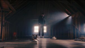 Young man hanging by neck in attic