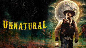 Stocky middle-aged cowboy stood in front of a full moon