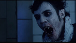 Young male vampire showing off his fangs