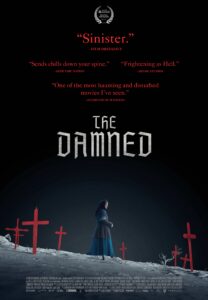 The Damned Theatrical Poster - Religious woman stood amongst a landscape of crosses