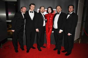 A small group of smartly dressed people
