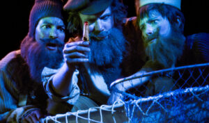 Three people wearing fake beards