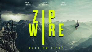 Person on a zipwire with mountains showing in the background